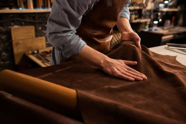 Clothing Material: Types Of Fabric And Their Uses 3 A leather tanner at work