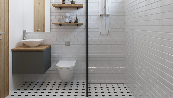 Une salle de bain classique avec toilettes suspendues