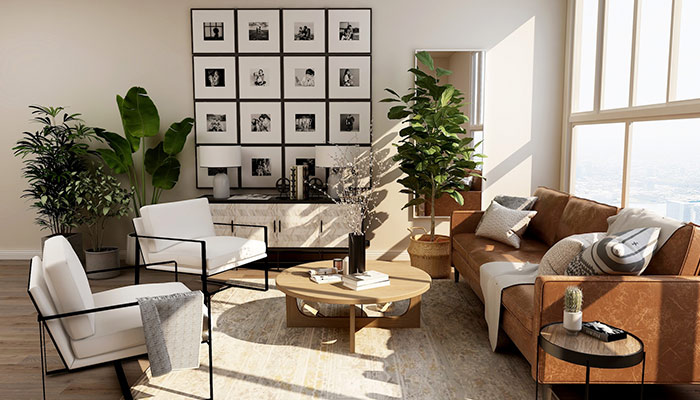 Le salon dont les murs sont décorés de tableaux