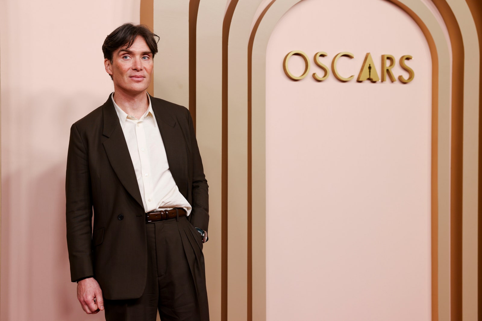 Image may contain Cillian Murphy Clothing Formal Wear Suit Coat Blazer Jacket Adult Person Accessories and Belt
